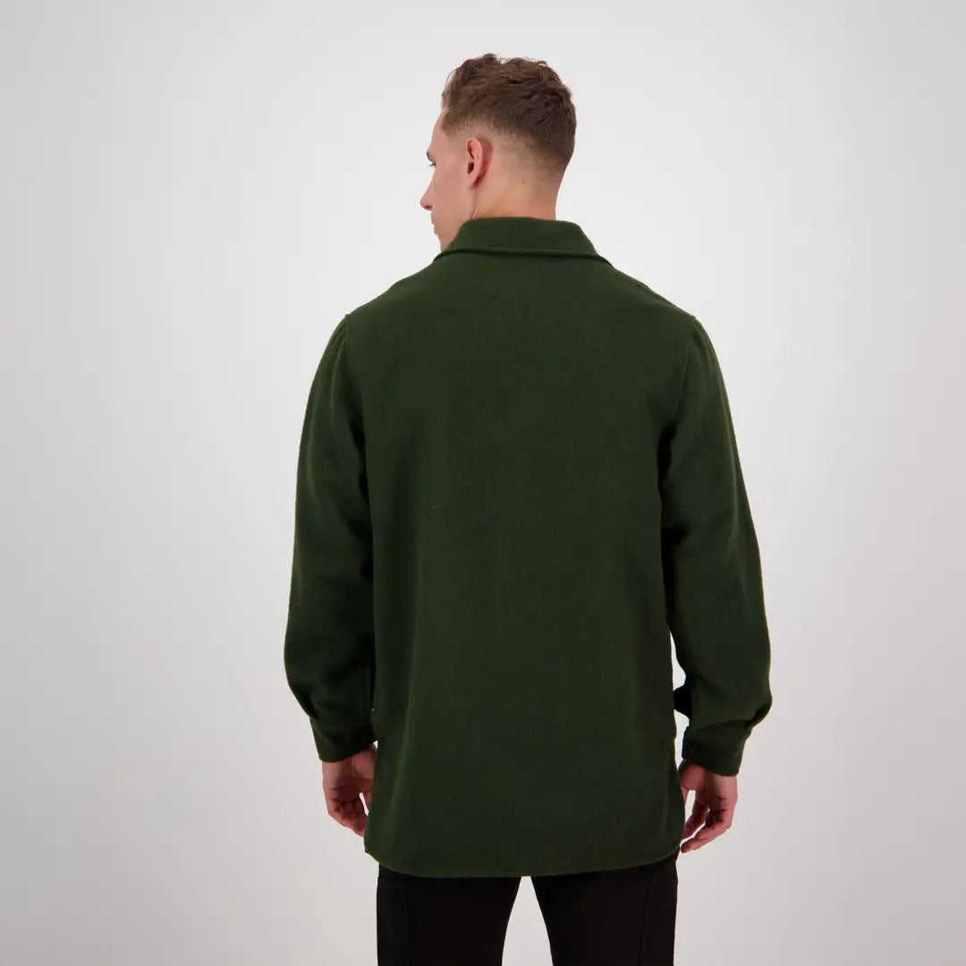 Dark green Swanndri Ranger Extreme V2 jacket seen from behind on a person