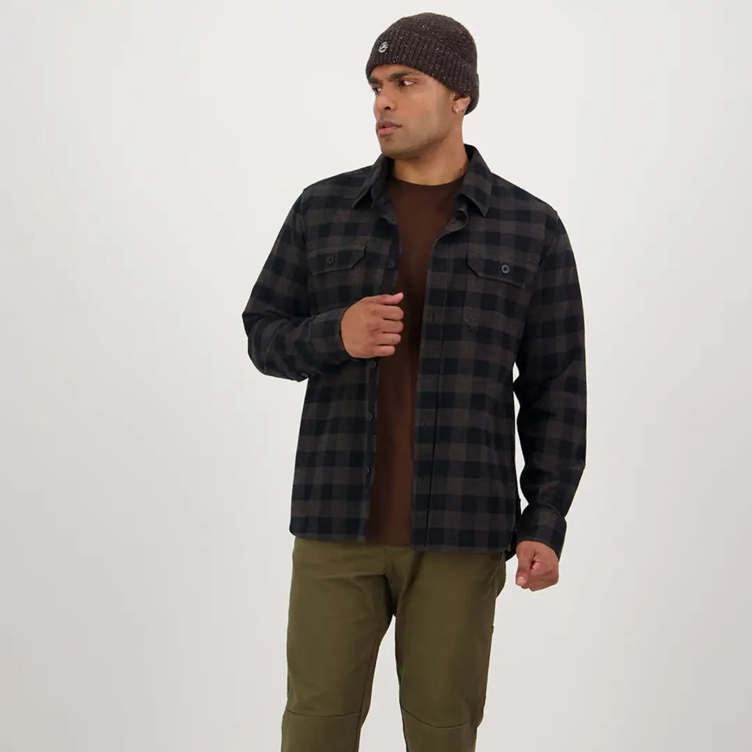 Plaid flannel shirt jacket over a brown sweater from Taranaki Tailor for country clothing