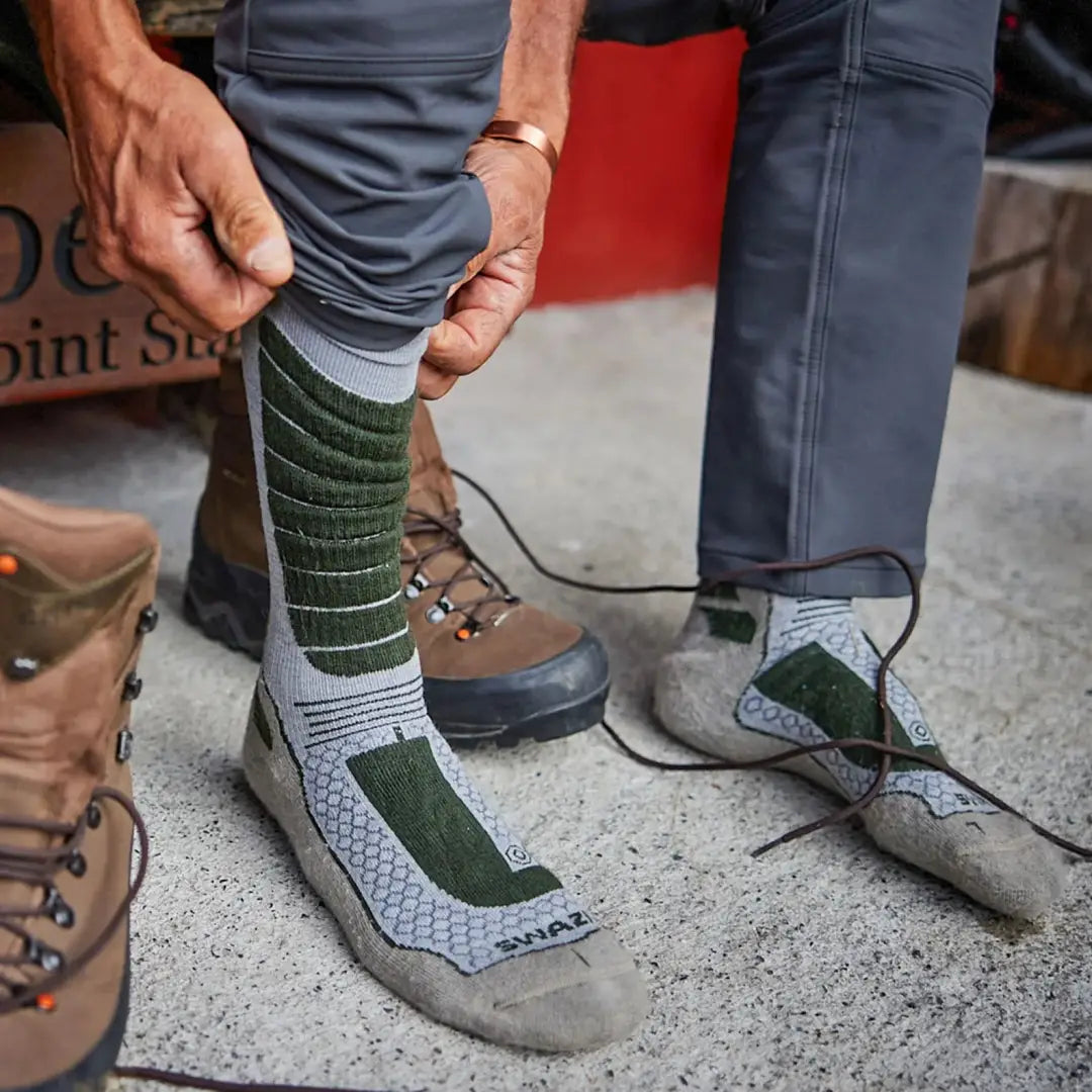 Hiking boots laced up with Swazi Ibex Socks for the perfect outdoors adventure