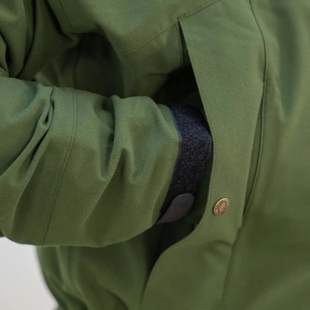 Green jacket with button closure, perfect for wet weather and the Swazi Tahr XP Smock