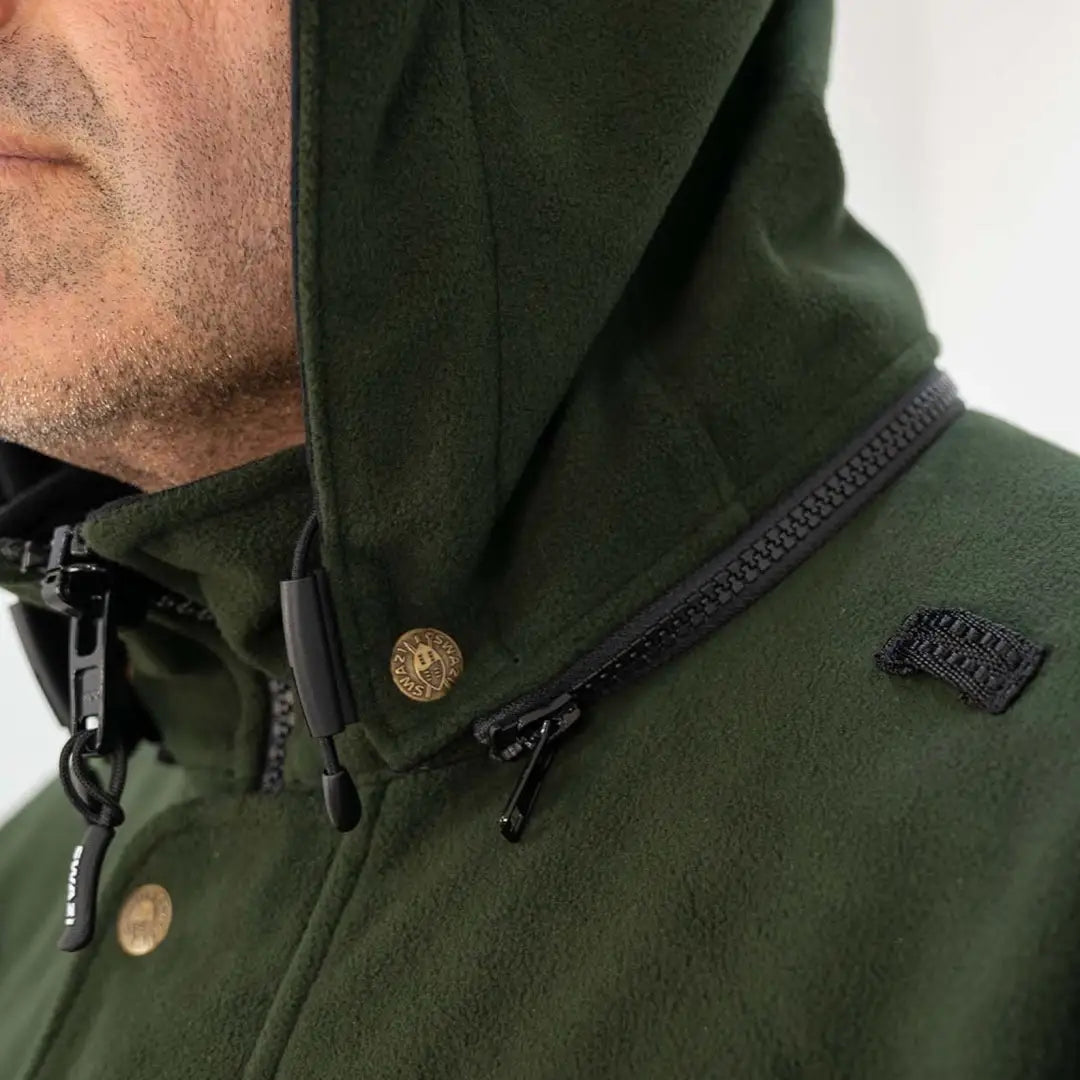 Dark green Swazi Windriver Jacket with high collar, zipper, and Aegis windshield fleece