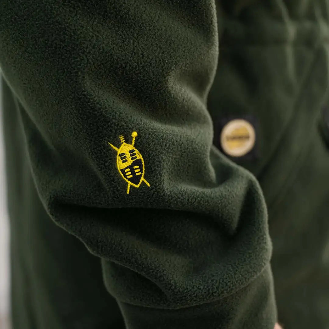 Dark green Swazi Windriver Jacket with bee logo, features Aegis windshield fleece