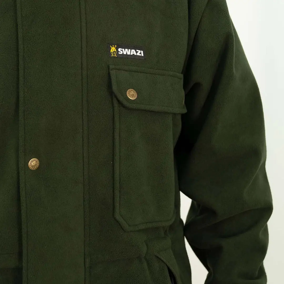 Dark green Swazi Windriver Jacket with logo, brass buttons, and aegis windshield fleece