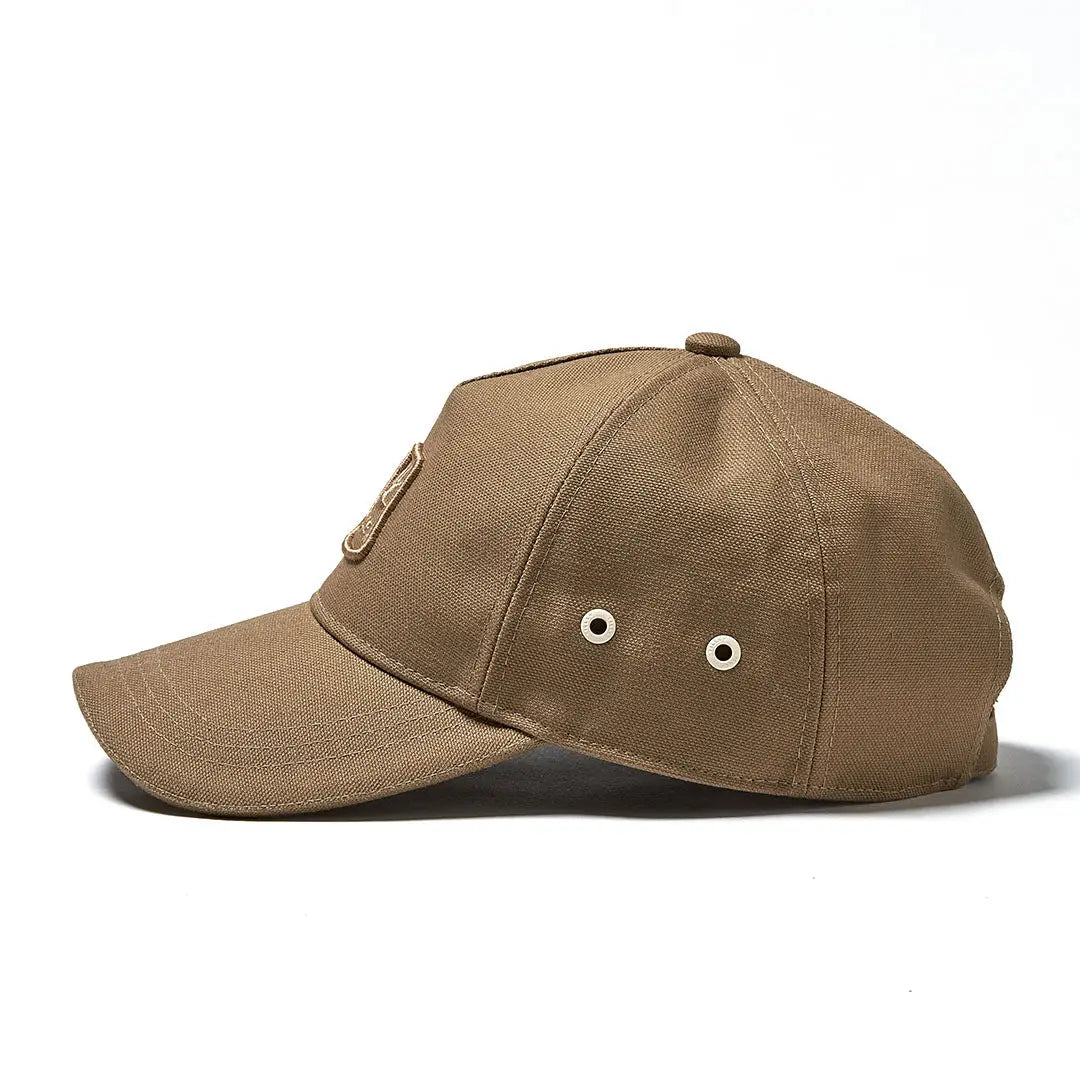 Tan Tilley Heritage Cap with metal eyelets and a stylish curved brim