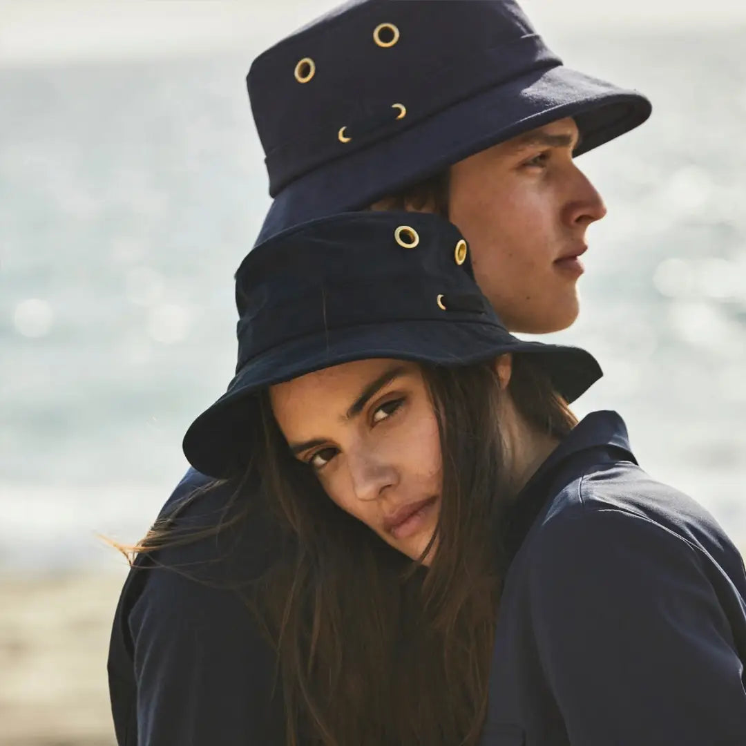 Navy blue durable water repellent bucket hat with gold grommet details, Tilley Iconic T1 Bucket