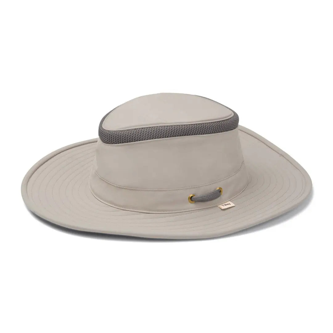 Wide-brimmed beige Tilley LTM6 Airflo Hat with a mesh band for breathability