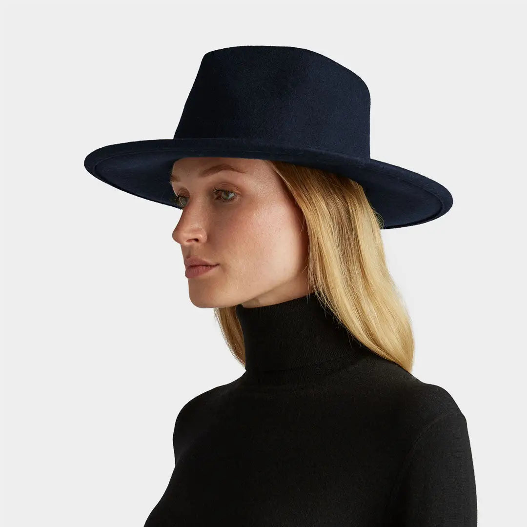 Navy blue Tilley New Jasper Hat on blonde-haired person, perfect for country clothing and hunting