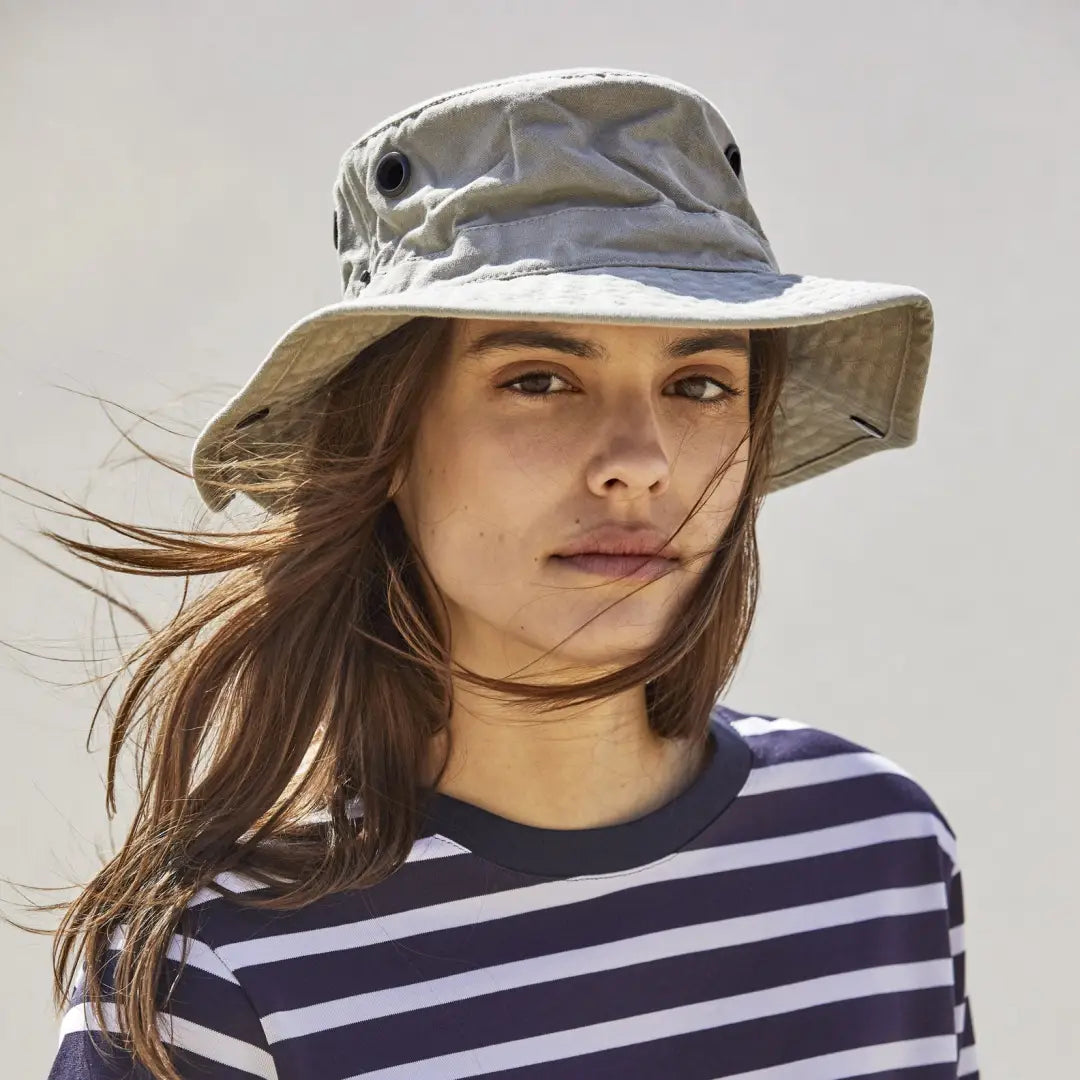 Woman in a Tilley T3 Wanderer Hat and striped shirt, perfect for country clothing