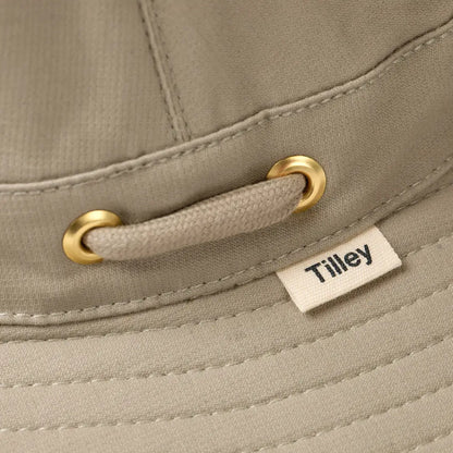 Beige Tilley T5MO Organic Airflo Hat with gold grommets and a stylish cord