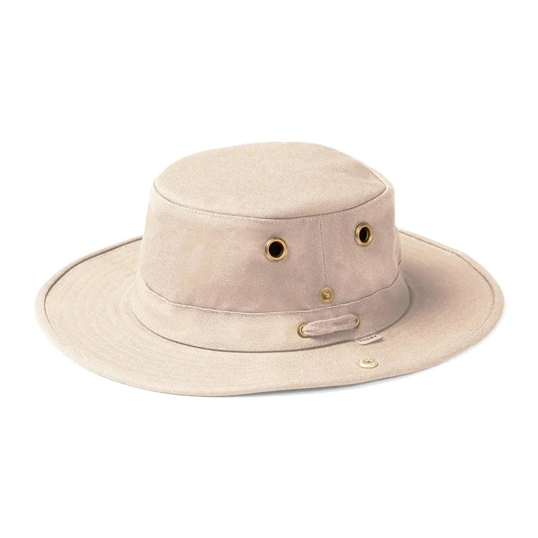 Beige Tilley TH5 Hemp Hat with sloped brim design and ventilation eyelets for comfort