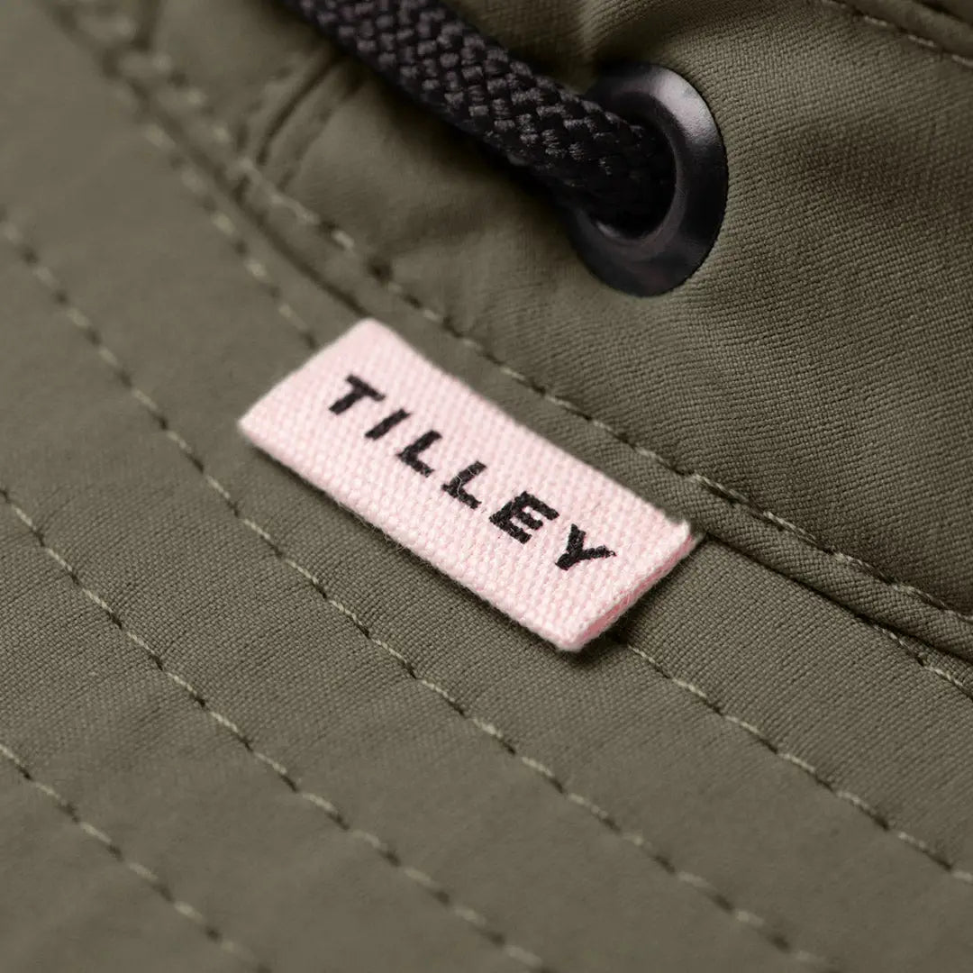 Fabric tag with Tilley on olive green material showcasing the Tilley Ultralight T5 Classic