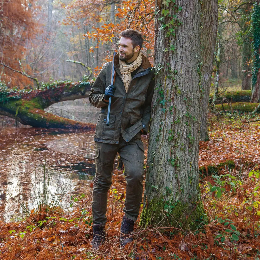 Man in Verney Carron Fox Original Trousers standing by tree in autumn forest