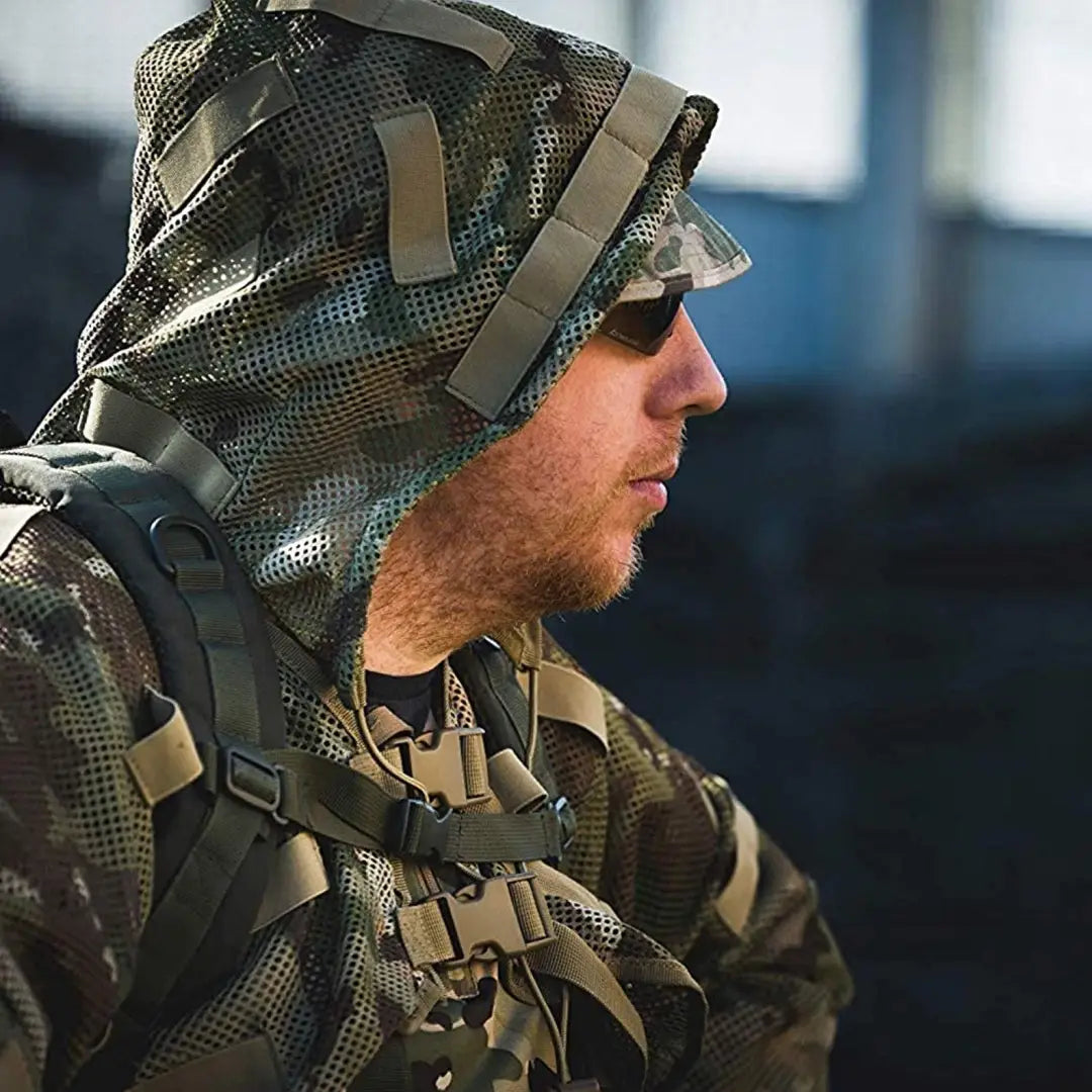 Soldier in a camouflage uniform showcasing the Viper Concealment Vest