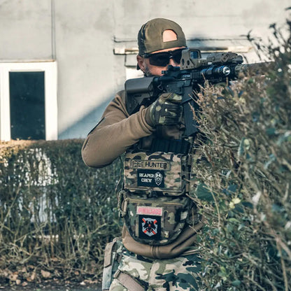 Armed soldier in tactical gear using the Viper VX Buckle Up Utility Rig with loop panel