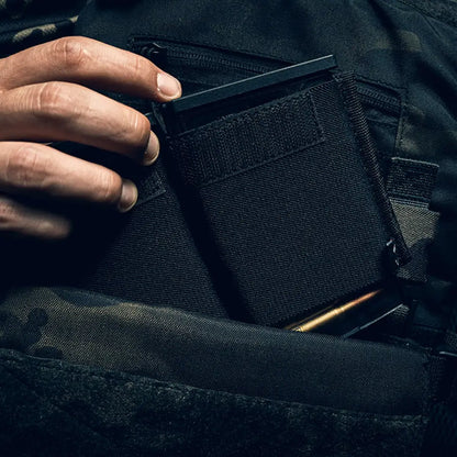 Hand holding a Black tactical wallet next to the Viper VX Double Rifle Mag Sleeve XL